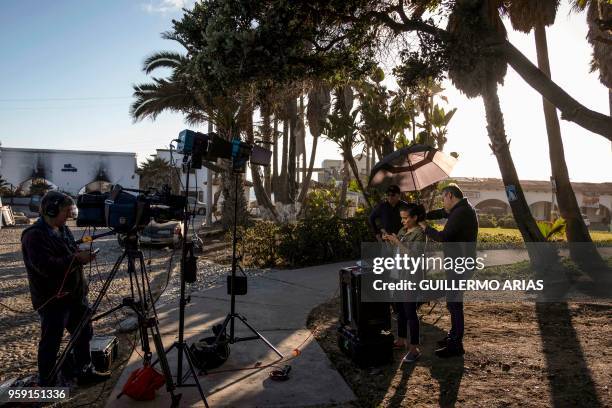 Journalists work in front of the residential area where Thomas Markle, the father of Meghan Markle, lives in San Antonio del Mar, Rosarito, Baja...