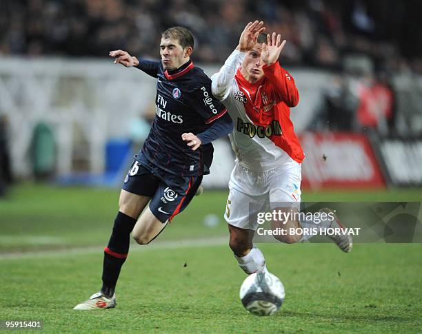 Paris' forward Christophe Jallet vies with Monaco's defender Diego Perez during the French L1 football match Paris Saint-Germain vs. Monaco on...