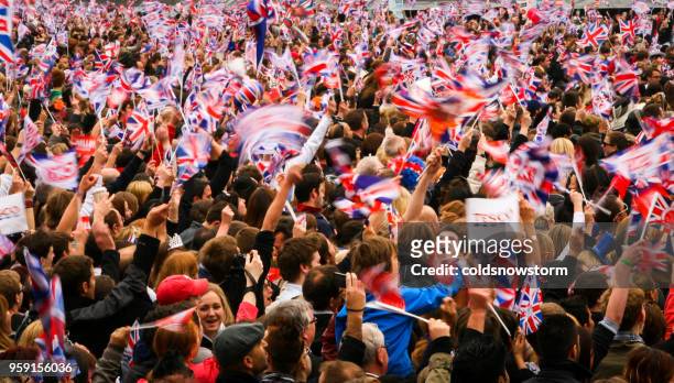 people waving british flags at royal wedding of prince william and kate middleton, london, uk - royal wedding 2011 stock pictures, royalty-free photos & images