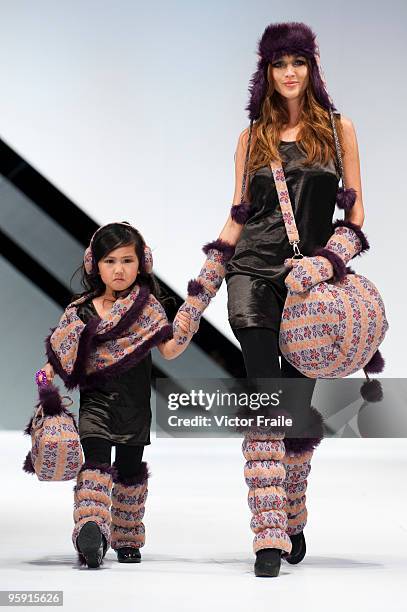 Models display creations of Tif & Tiffy's Love Rain collection on the catwalk during the Brand Collection Show II show as part of the Hong Kong...