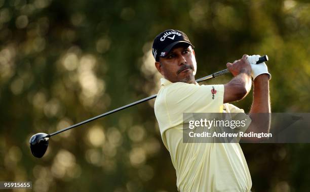 Jeev-Milka Singh of India hits his tee-shot on the ninhth hole during the first round of The Abu Dhabi Golf Championship at Abu Dhabi Golf Club on...