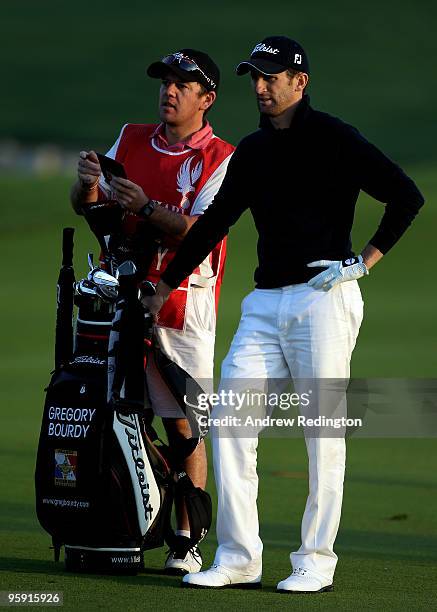 Gregory Bourdy of France waits to play his second shot on the first hole during the first round of The Abu Dhabi Golf Championship at Abu Dhabi Golf...