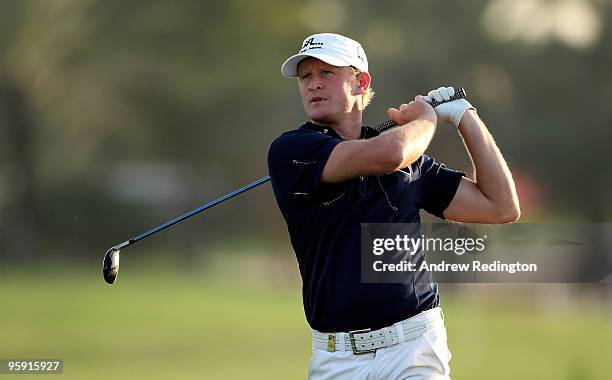 Jamie Donaldson of Wales hits his second shot on the ninth hole during the first round of The Abu Dhabi Golf Championship at Abu Dhabi Golf Club on...