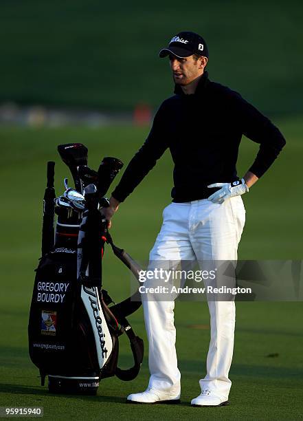 Gregory Bourdy of France waits to play his second shot on the first hole during the first round of The Abu Dhabi Golf Championship at Abu Dhabi Golf...