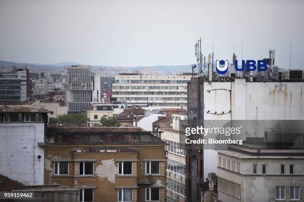 The United Bulgarian Bank AD logo sits on top of a building as commercial and residential property stands on the city skyline in Sofia, Bulgaria, on...