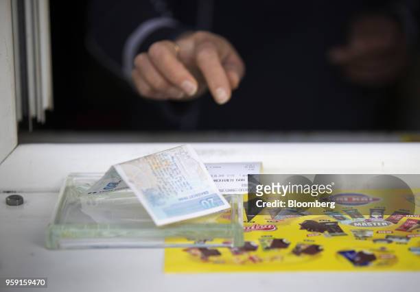 Lev banknote sits in a change dish on a snack kiosk counter in Sofia, Bulgaria, on Wednesday, May 16, 2018. The EU's poorest-nation, which holds the...