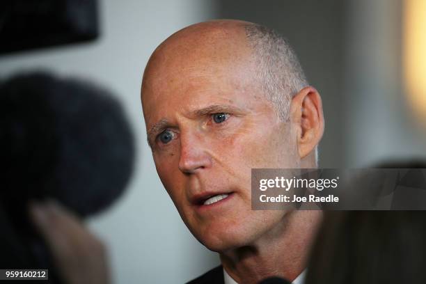 Florida Governor Rick Scott speaks to the media as he attends the Governor's Hurricane Conference at Palm Beach County Convention Center on May 16,...