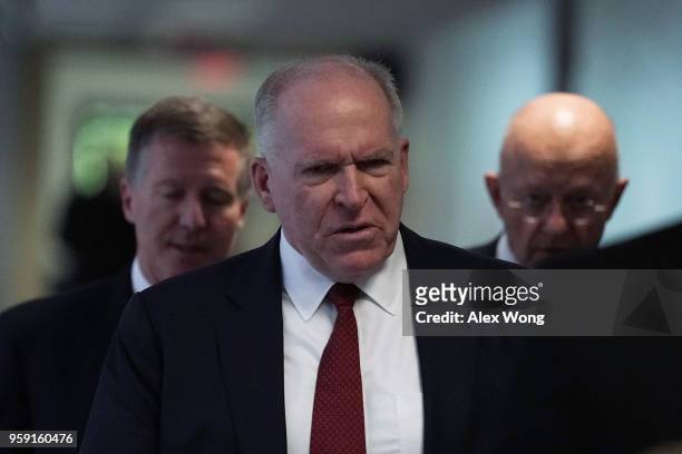 Former CIA director John Brennan and former director of National Intelligence James Clapper arrive at a closed hearing before the Senate Intelligence...
