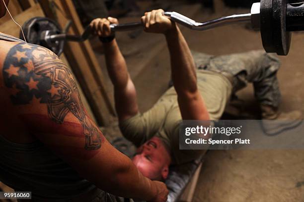 Members of US Army Able Company, 3-509 Infantry Battalion workout in the gym at Combat Outpost Zerak on January 21, 2010 in Zerak, Afghanistan. COP...