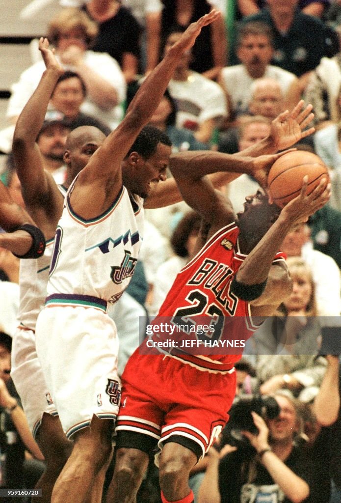 Shandon Anderson of the Utah Jazz guards Michael Jordan of the