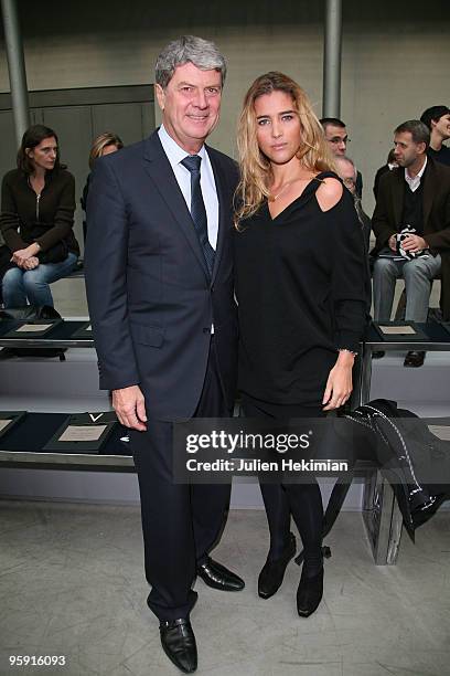 Vahina Giocante ( and Yves Carcelles attends the Louis Vuitton fashion show during Paris Menswear Fashion Week Autumn/Winter 2010 at Le 104 on...