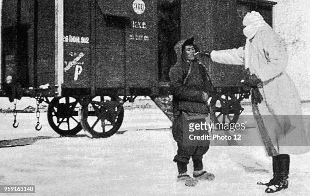 January 1911, examination of a man suspected to be plague-striken, in front of a quarantine wagon.