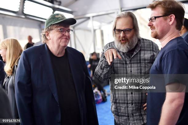 Michael Moore, Dan Harmon, and Justin Roiland attend the Turner Upfront 2018 arrivals on the red carpet at The Theater at Madison Square Garden on...