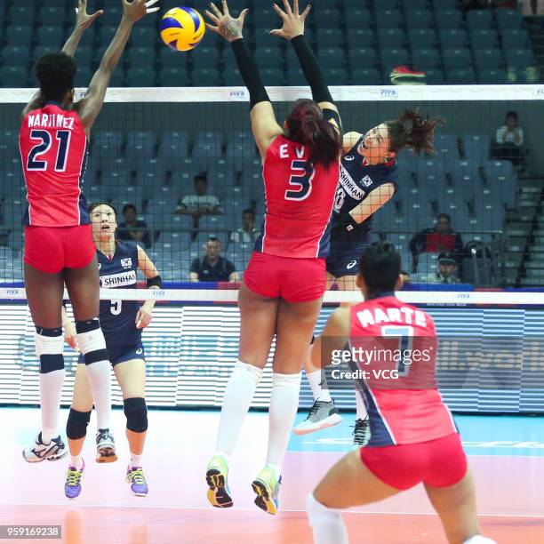 Yeon Koung Kim of South Korea competes against Lisvel Elisa Eve Mejia and Jineiry Martinez of the Dominican Republic during the FIVB Volleyball...