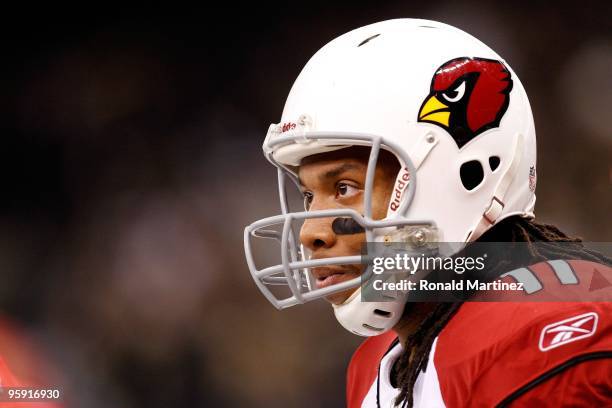 Larry Fitzgerald of the Arizona Cardinals looks on against the New Orleans Saints during the NFC Divisional Playoff Game at Louisana Superdome on...