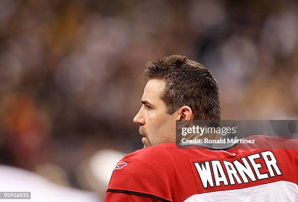 Quarterback Kurt Warner of the Arizona Cardinals looks on from the sideline against the New Orleans Saints during the NFC Divisional Playoff Game at...