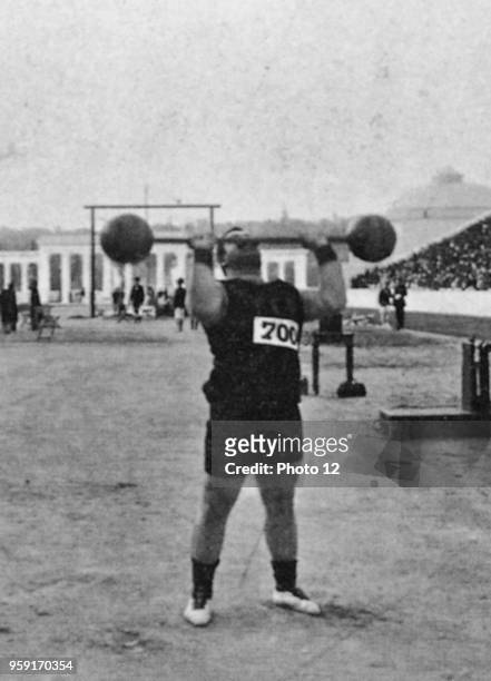 Olympic interlude in 1906 in Athen; The Greek Tophalos wins the weight lifting event; Chronik d. Sports S. 233.