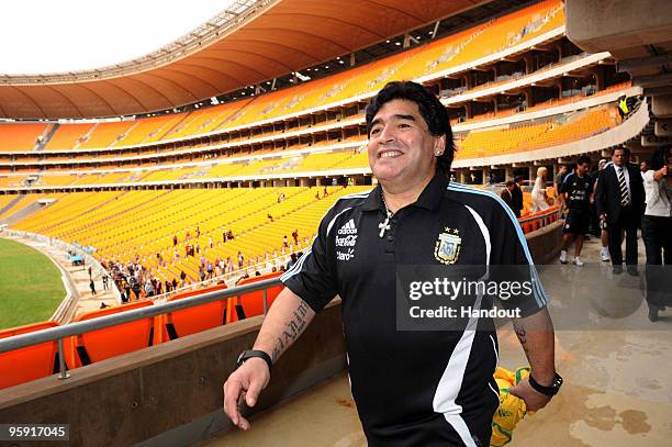 In this handout image provided by the 2010 FIFA World Cup Organising Committee South Africa, Argentina head coach Diego Maradona visits Soccer City...