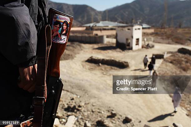 Member of the Afghan National Police stands outside of Combat Outpost Zerak on January 21, 2010 in Zerak, Afghanistan. COP Zerak, located in Paktika...