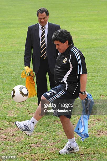 In this handout image provided by the 2010 FIFA World Cup Organising Committee South Africa, Argentina head coach Diego Maradona and Danny Jordaan,...