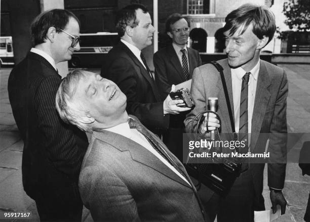 British Conservative politician Chris Patten, the Secretary of State for the Environment, during a radio interview outside the Department of the...