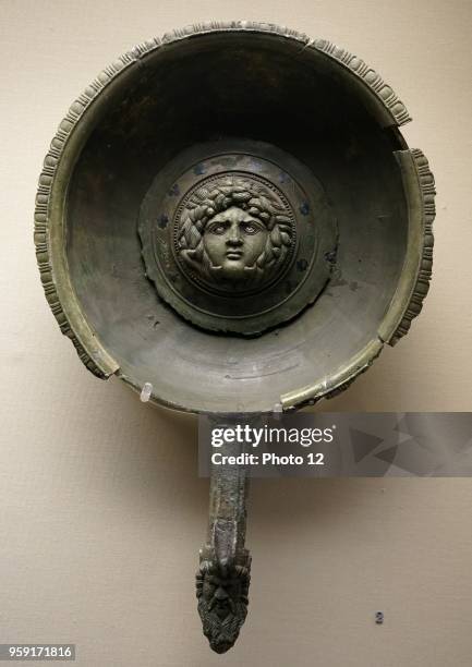 Bronze paterae with a central roundel depicting the head of Medusa, from Faversham, Kent. Dated 1st Century AD.