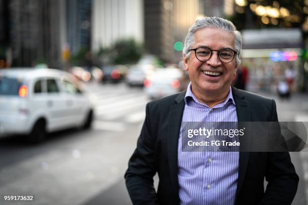 mature business man portrait on sao paulo, brazil - avenida paulista imagens e fotografias de stock