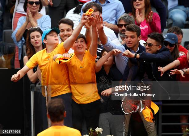 Rafael Nadal of Spain throws his wrist band into the crowd as he celebrates defeating Damir Dzumhur Bosnia during day four of the Internazionali BNL...