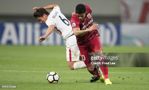 Hulk of Shanghai SIPG and Ryota Nagaki of Kashima Antlers in action during the AFC Champions League Round of 16 match between Shanghai SIPG v Kashima...