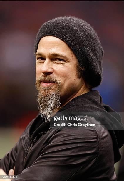 Actor Brad Pitt stands on the sidelines during warm ups prior to the New Orleans Saints hosting the Arizona Cardinals during the NFC Divisional...