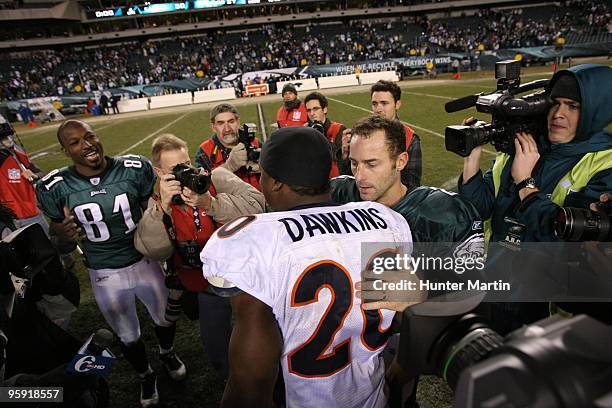 Kicker David Akers of the Philadelphia Eagles shares a moment with safety Brian Dawkins of the Denver Broncos after a game on December 27, 2009 at...