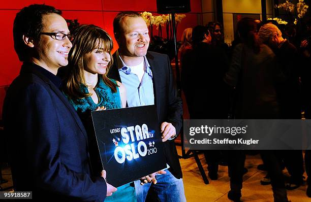 German TV hosts Matthias Opdenhövel, Sabine Heinrich and entertainer Stefan Raab pose for photographers prior to a press conference on January 21,...