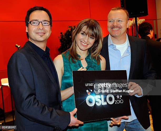 German TV hosts Matthias Opdenhövel, Sabine Heinrich and entertainer Stefan Raab pose for photographers prior to a press conference on January 21,...