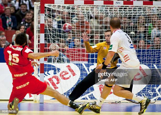 Alexander Petersson of Iceland, Thomas BAUER of Austria and Patrick Foelser of Austria take part in the EHF Handball Euro 2010 Game Austria vs...