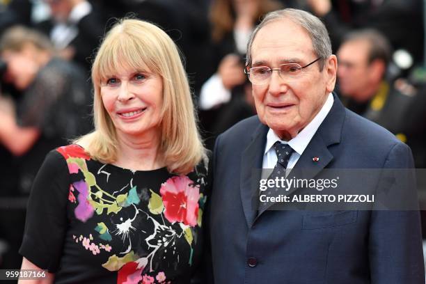 French director Robert Hossein and his wife French actress Candice Patou arrive on May 16, 2018 for the screening of the film "Burning" at the 71st...
