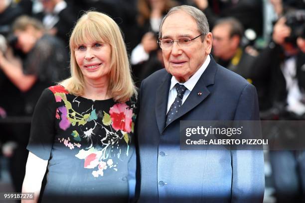 French director Robert Hossein and his wife French actress Candice Patou arrive on May 16, 2018 for the screening of the film "Burning" at the 71st...