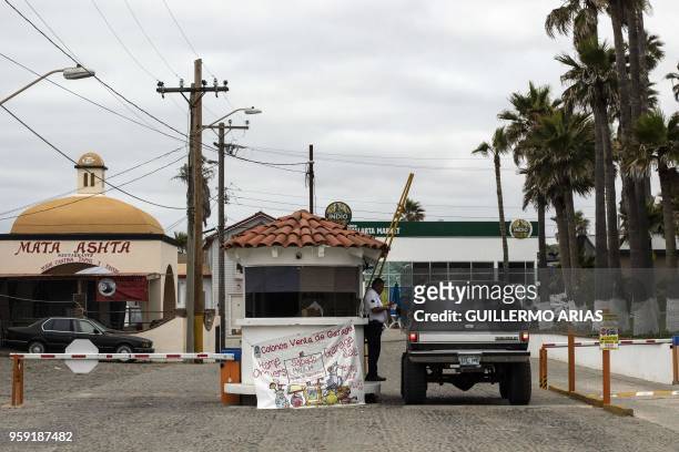 Security guard checks papers at the entrance of the residential area where Thomas Markle, the father of Meghan Markle, lives in San Antonio del Mar,...