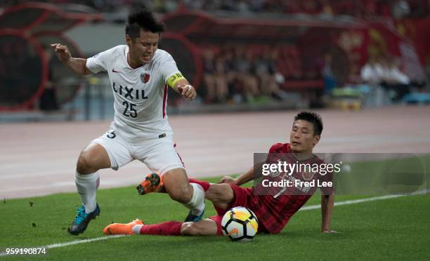 Wu Lei of Shanghai SIPG and Yasushi Endo of Kashima Antlers in action during the AFC Champions League Round of 16 match between Shanghai SIPG v...