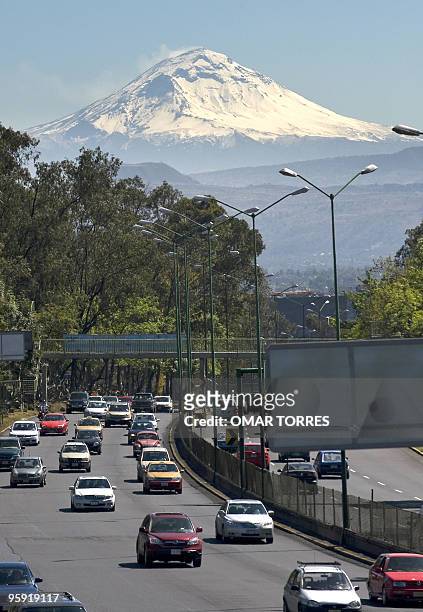 Unusual view of the Popocatepetl volcano in a rare clear day in Mexico City. AFP PHOTO/Omar TORRES