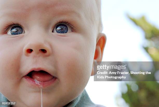 baby boy drooling - spit stock pictures, royalty-free photos & images