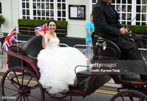 S Laura Tobin rides a horse-drawn carriage during Prince Harry and Meghan Markle's Wedding preparations today on May 16, 2018 in Windsor, England.