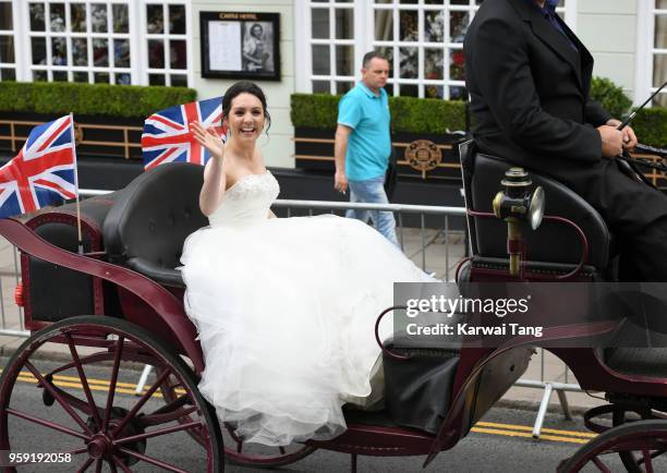 S Laura Tobin rides a horse-drawn carriage during Prince Harry and Meghan Markle's Wedding preparations today on May 16, 2018 in Windsor, England.