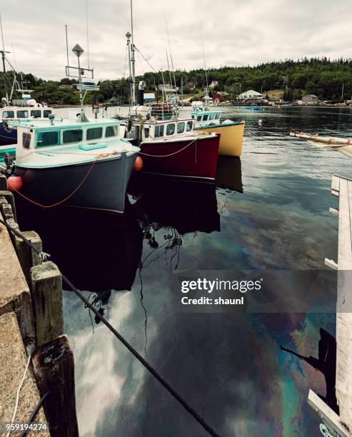 fishing village oil spill - oil spill stock pictures, royalty-free photos & images