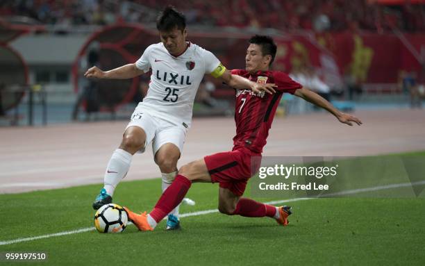 Wu Lei of Shanghai SIPG and Yasushi Endo of Kashima Antlers in action during the AFC Champions League Round of 16 match between Shanghai SIPG v...