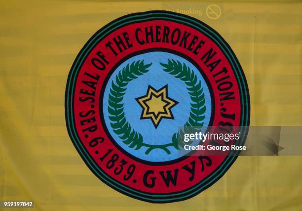 Flag denoting the Cherokee Nation hangs on a wall along the highway on May 11, 2018 in Cherokee, North Carolina. Located near the entrance to Great...