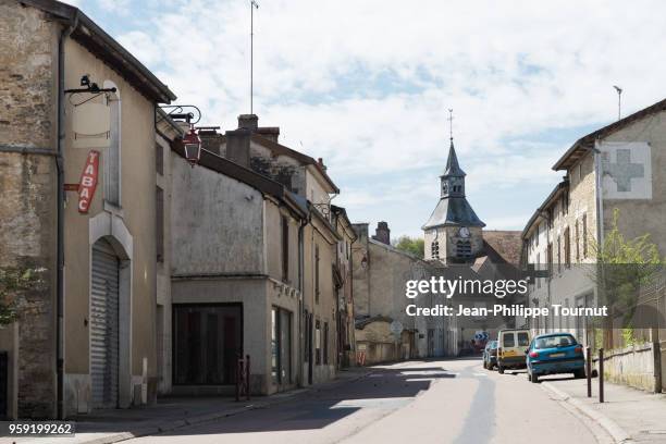 typical quiet village street in france - village france photos et images de collection