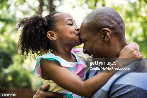 father and daughter playing in backyard - father and daughter play imagens e fotografias de stock