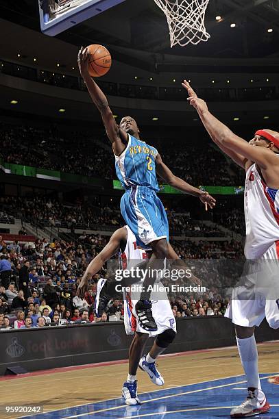 Darren Collison of the New Orleans Hornets shoots a layup against Charlie Villanueva of the Detroit Pistons during the game at the Palace of Auburn...