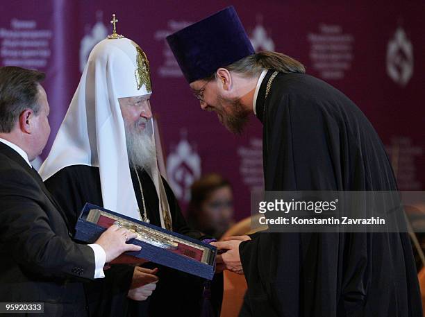 Russian Orthodox Patriarch Kirill presents John Behr, dean of St. Vladimir's Orthodox Seminary in Crestwood, N.Y. With an award during an awards...
