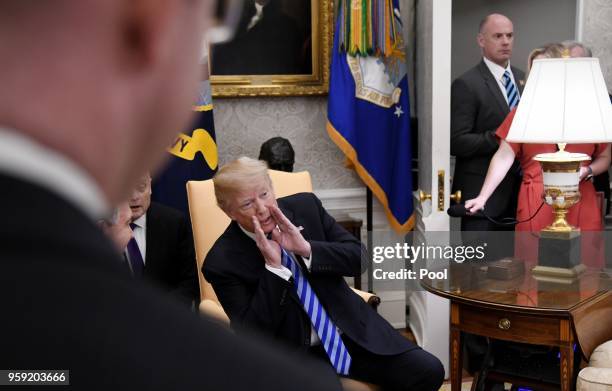 President Donald Trump speaks to reporters during a meeting with the President of the Republic of Uzbekistan Shavkat Mirziyoyev in the Oval Office of...